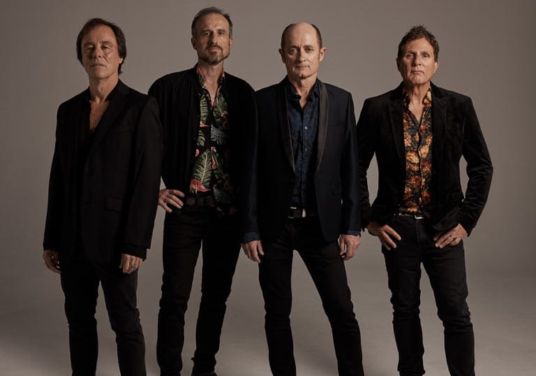 Portrait of Hoodoo Gurus band members standing