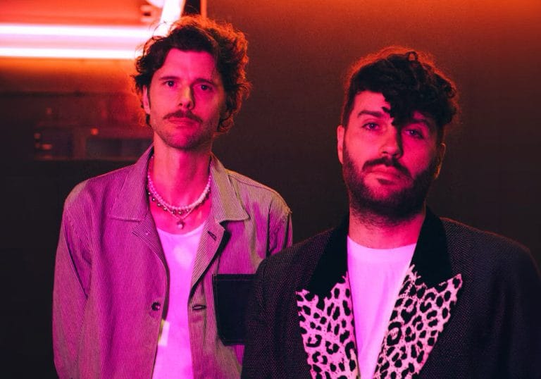 Miami Horror Miami Horror pictured under pink neon light reflections
