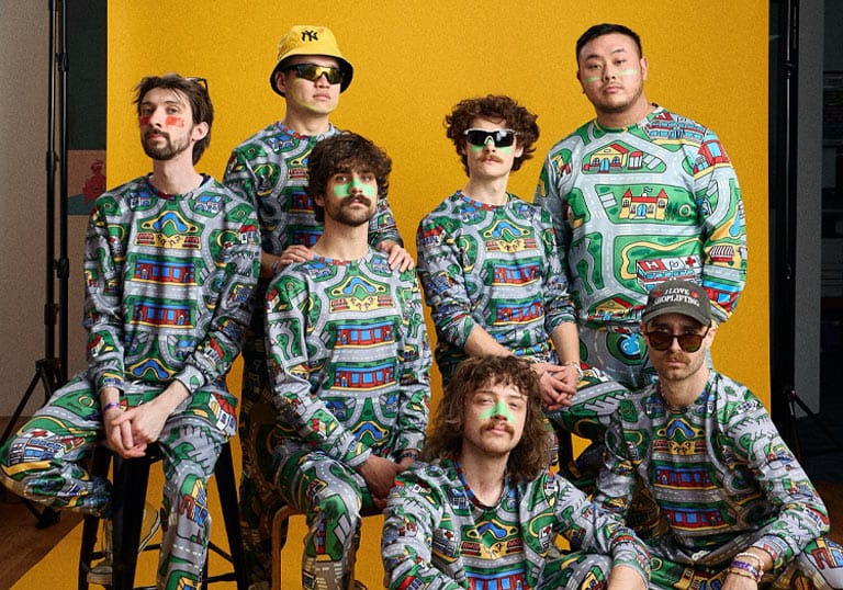 Playlunch band wearing matching pyjamas with cartoon road fabric